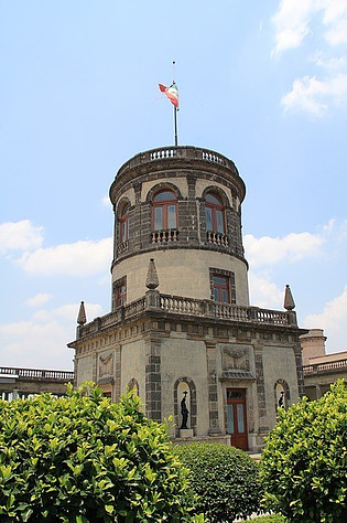 Front of Chapultepec Castle with a Mexican flag on top.