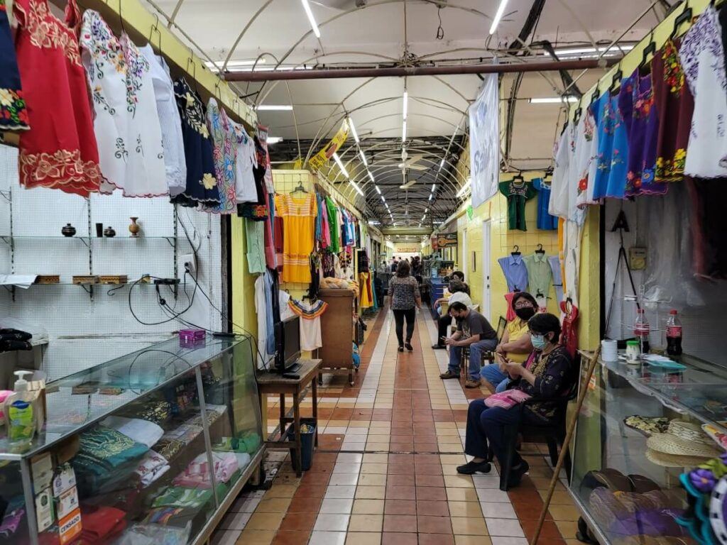 A market hall lined with typical Yucatecan clothing.