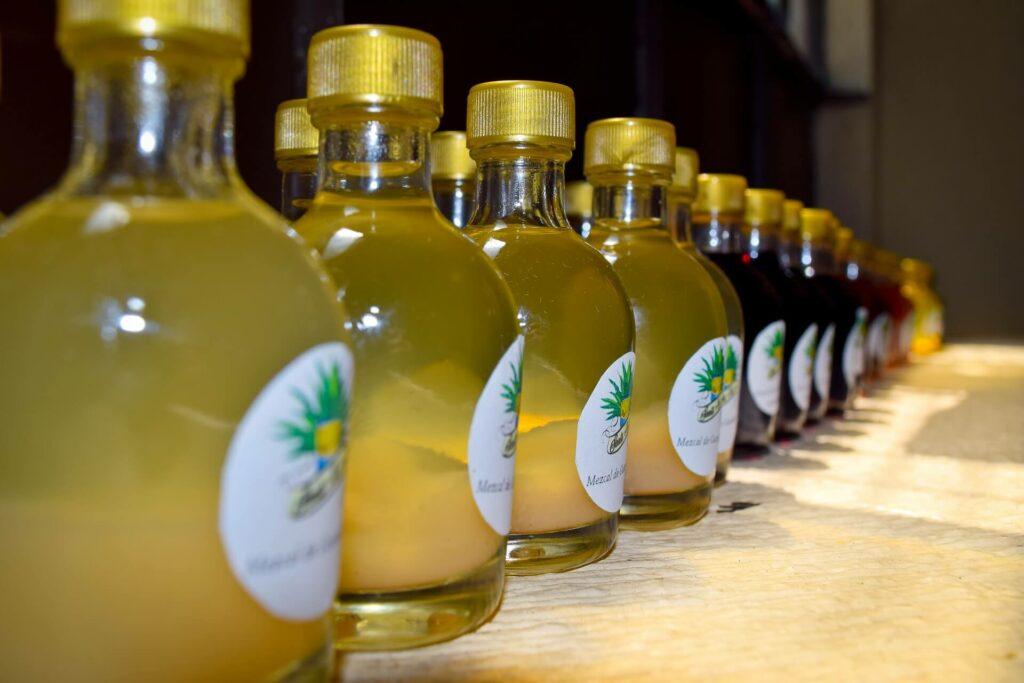 Several mezcal bottles in a row.