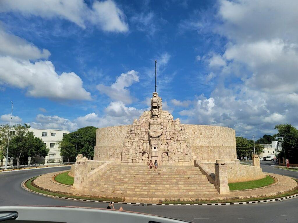  A Maya monument in a roundabout.