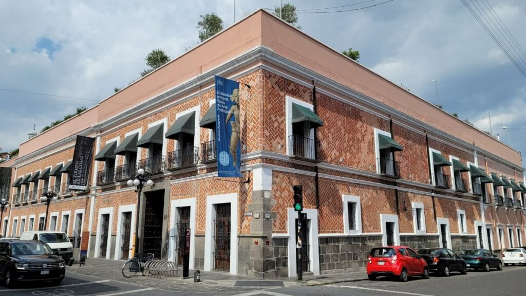 Corner of a building with orange tiles.