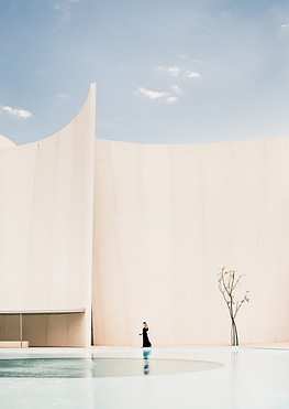 Front view of the Museo Internacional del Barroco with a woman walking by.