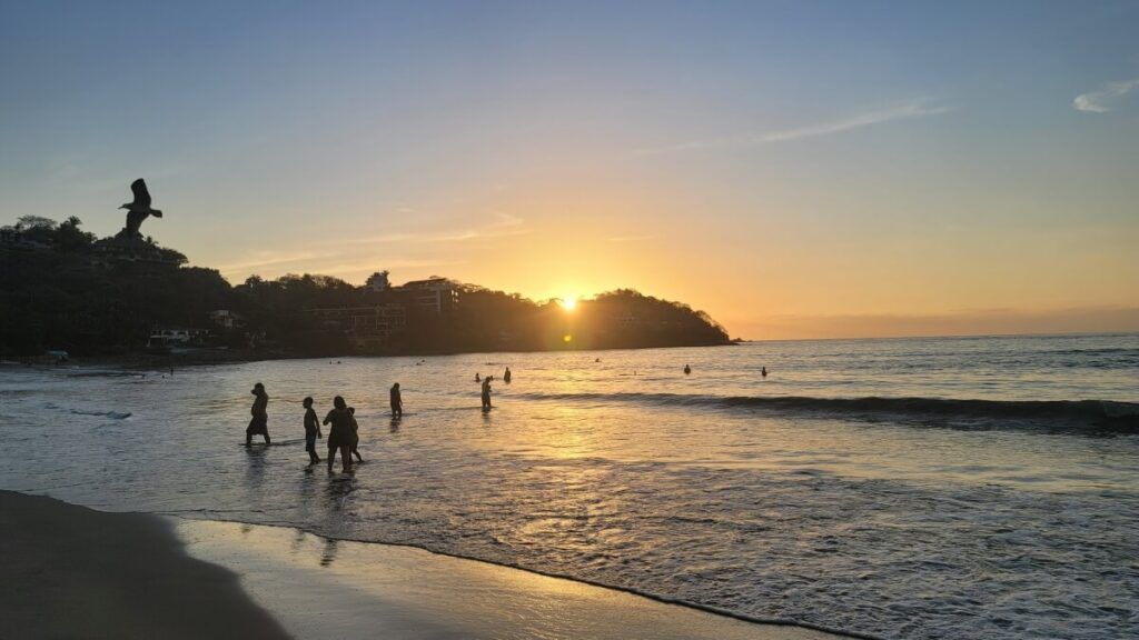 A beach at sunset.