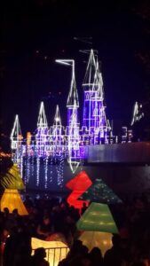 Illuminated castle in bluish white tones.