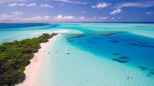 Cancun beach surrounded by turquoise water.