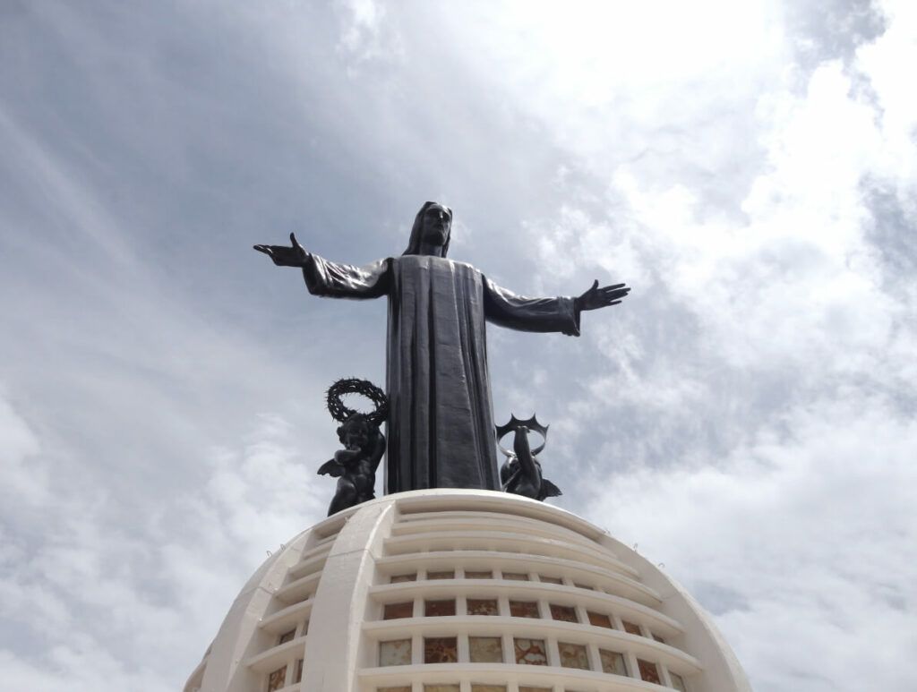 A huge bronze statue of Christ.