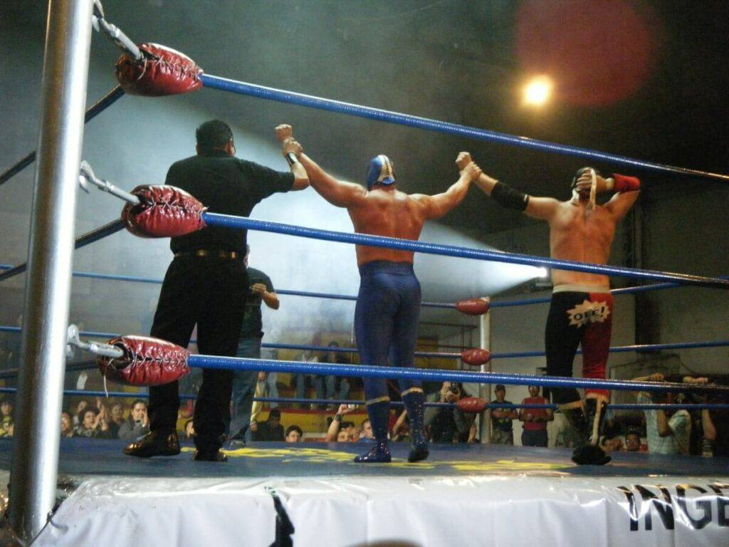 A couple of Mexican wrestlers at a match.