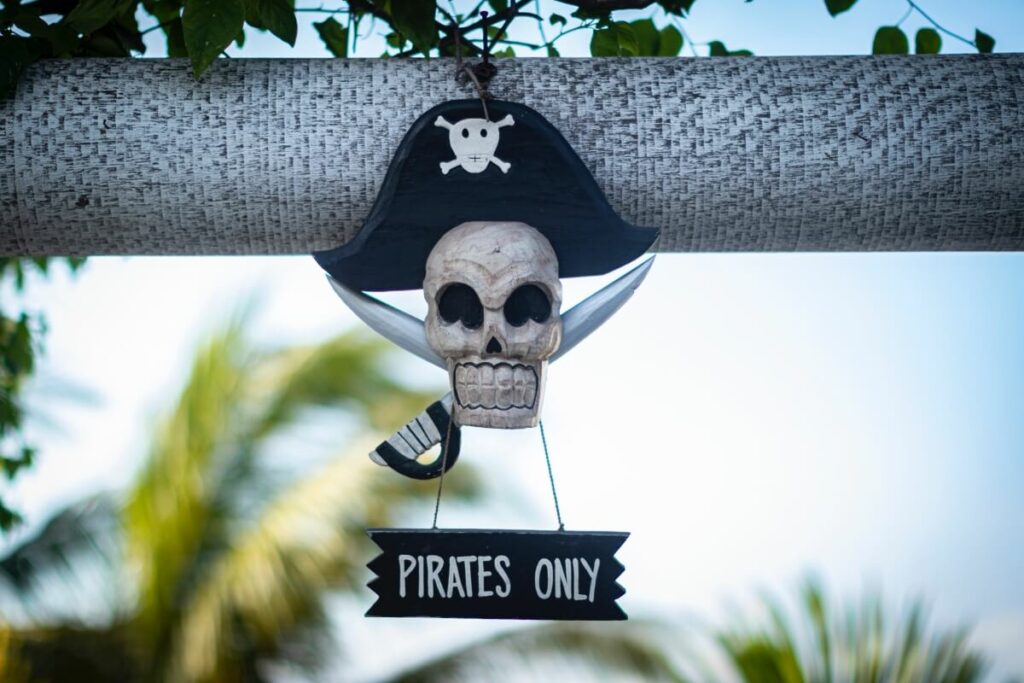 Little skull with a little sign reading pirates only.