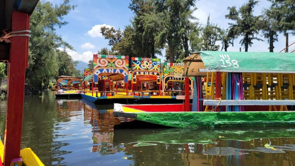 A group of colorful boats in a canal.