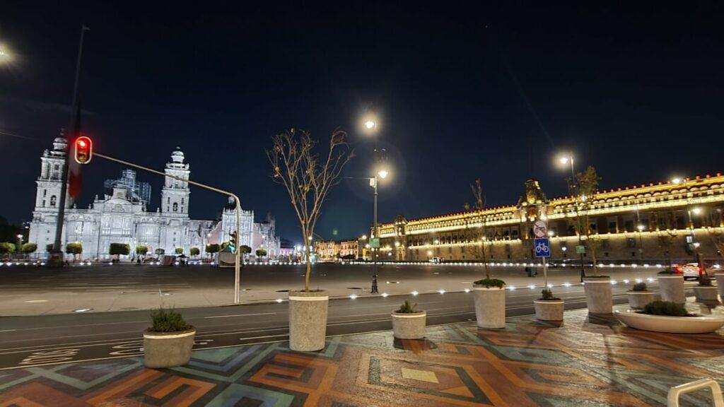 Plaza in Mexico City lit up at night.