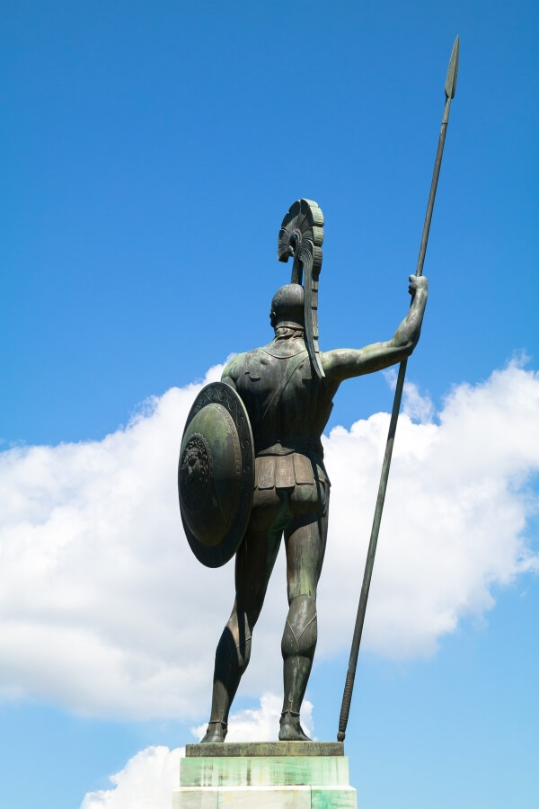 Statue of Achilles holding a shield and a spear.