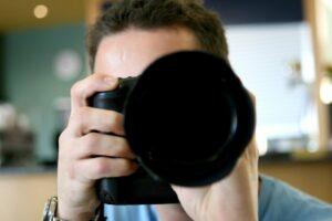 Man holding a camera in his hand.