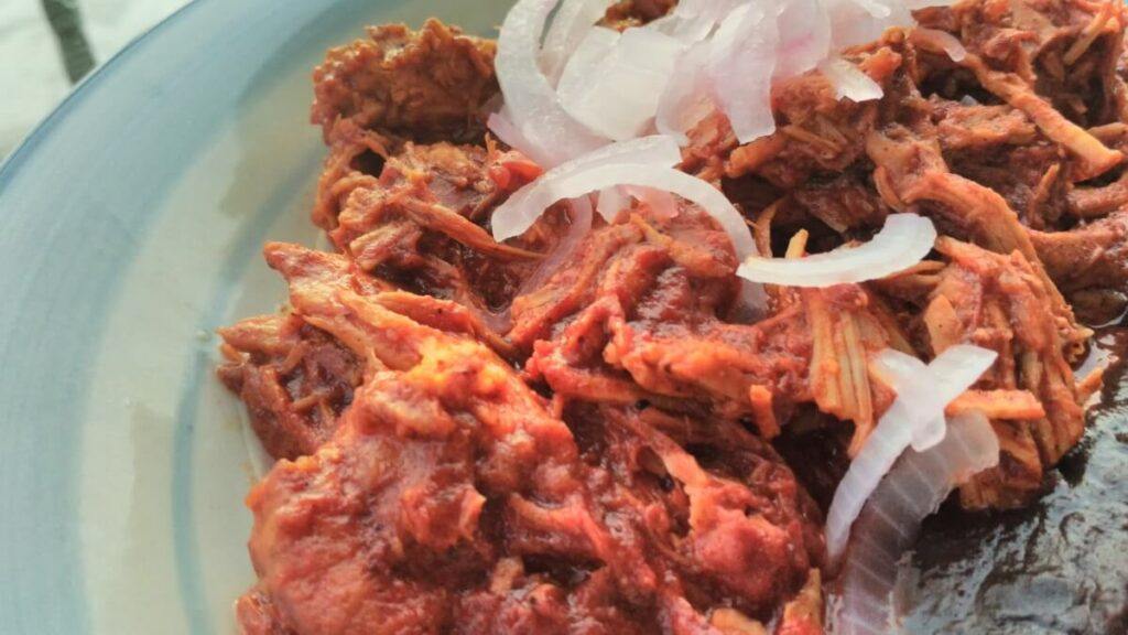 Shredded pork meat with chili and onion.
