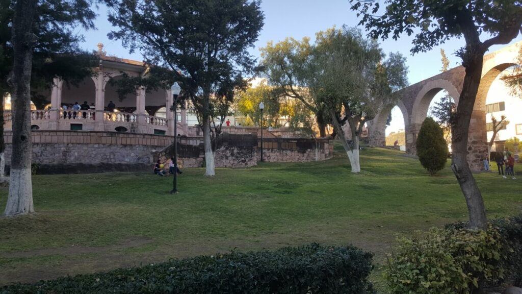 Park with a kiosk in the back.