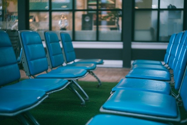 Empty blue seats at an aiport.