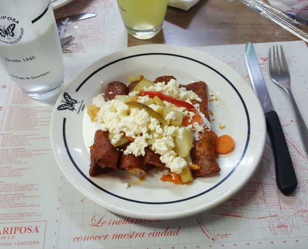 Enchiladas queretanas with cheese, potatoes, and carrots.