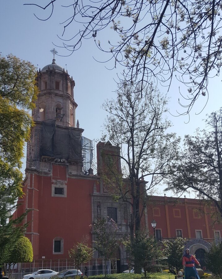 A red Colonial church in Queretaro City.