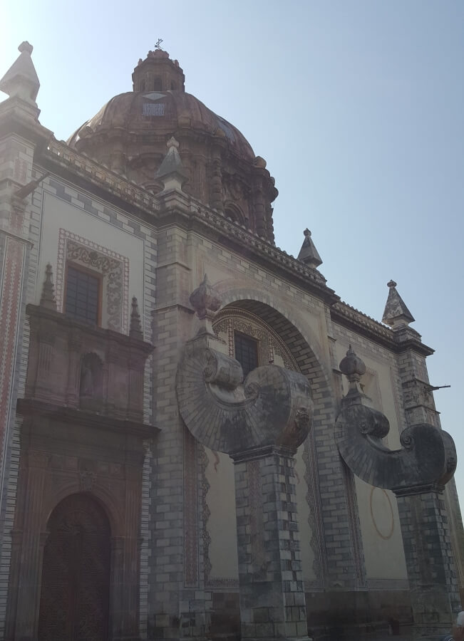 Church with two buttresses on its facade.