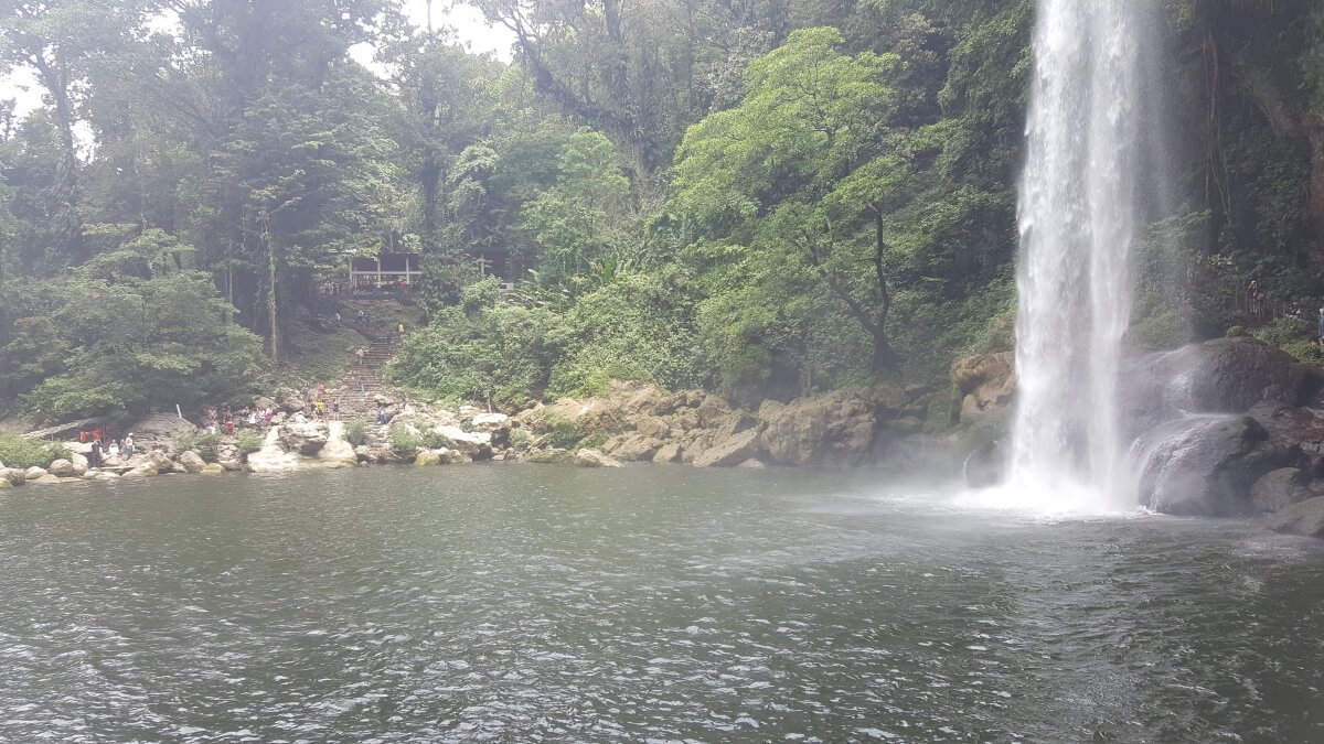 Water falling from a waterfall into a lake.