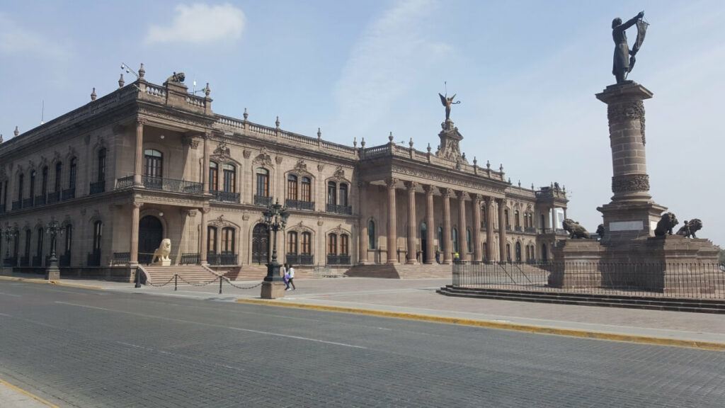 The old Nuevo Leon Government Palace with a statue in front of it.