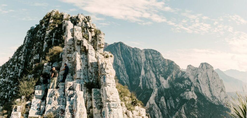 A mountain with sparse vegetation on it.