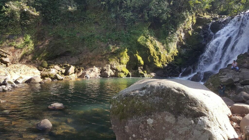 A waterfall and a swimming hole.