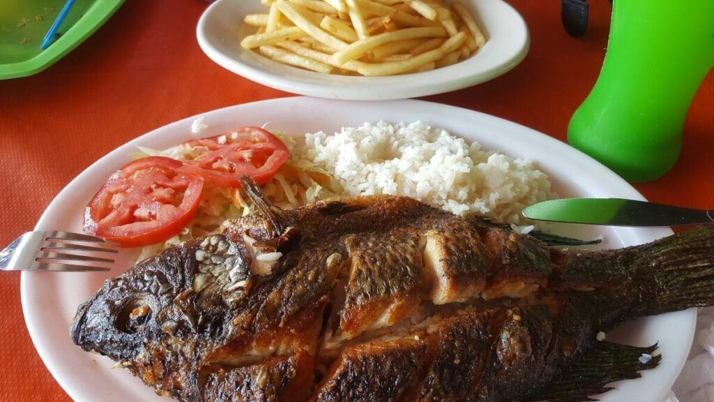 Pescado zarandeado with rice and vegetables.