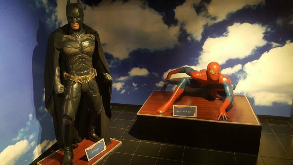 Batman and Spiderman wax figures.