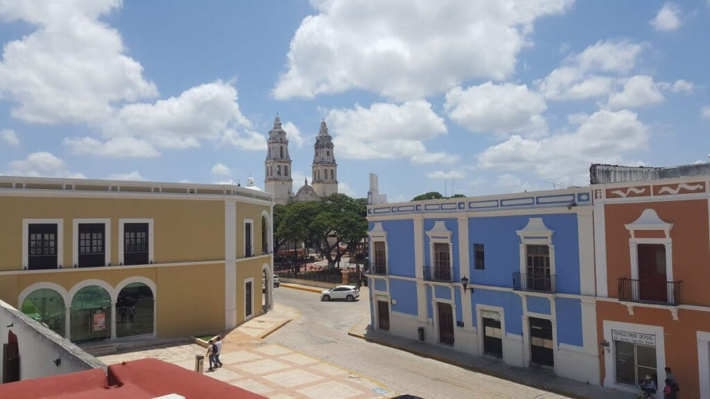 Colorful buildings seen from the top of a wall.