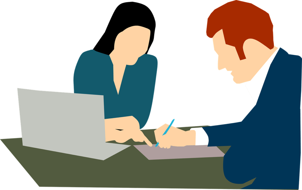 A man and a woman signing a contract.