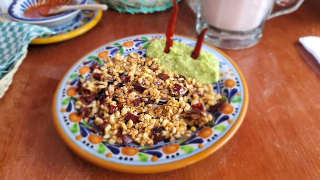 A plate with ant eggs and guacamole.