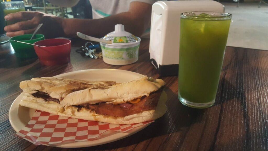A kind of torta and a green drink.