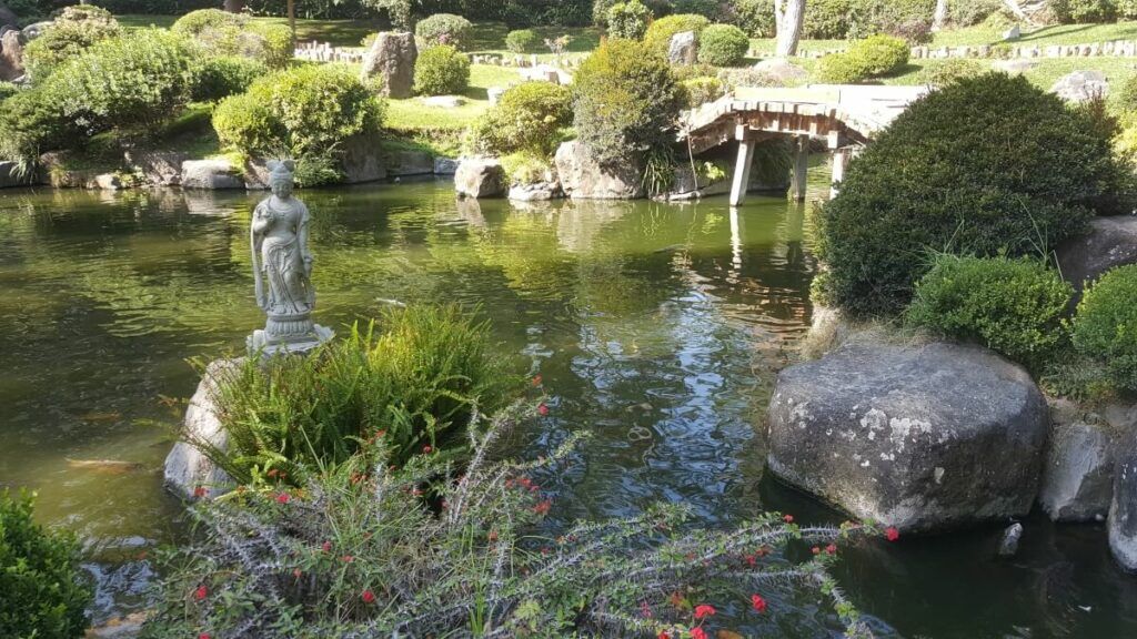A Japanese garden with a pond.