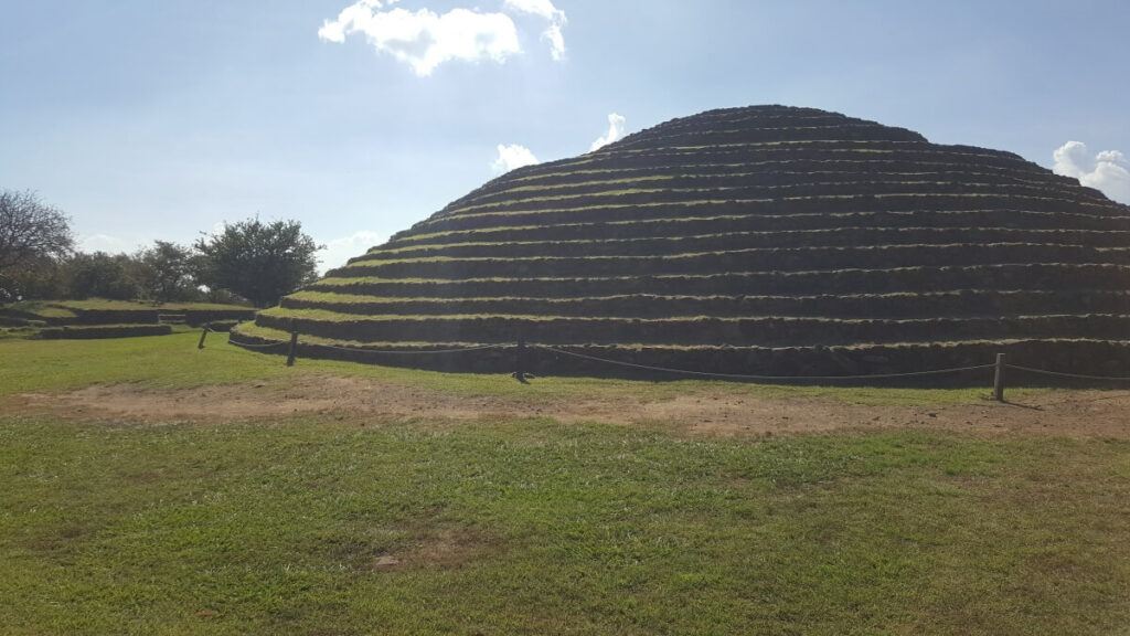 Circular pyramid covered in grass.