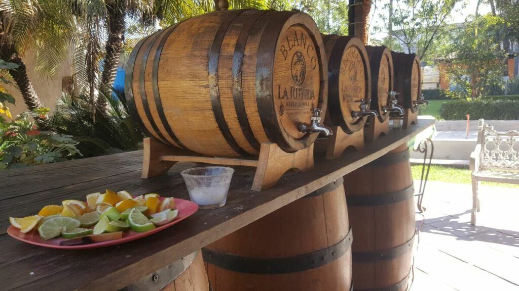 Tequila barrels and a plate with lime and salt.