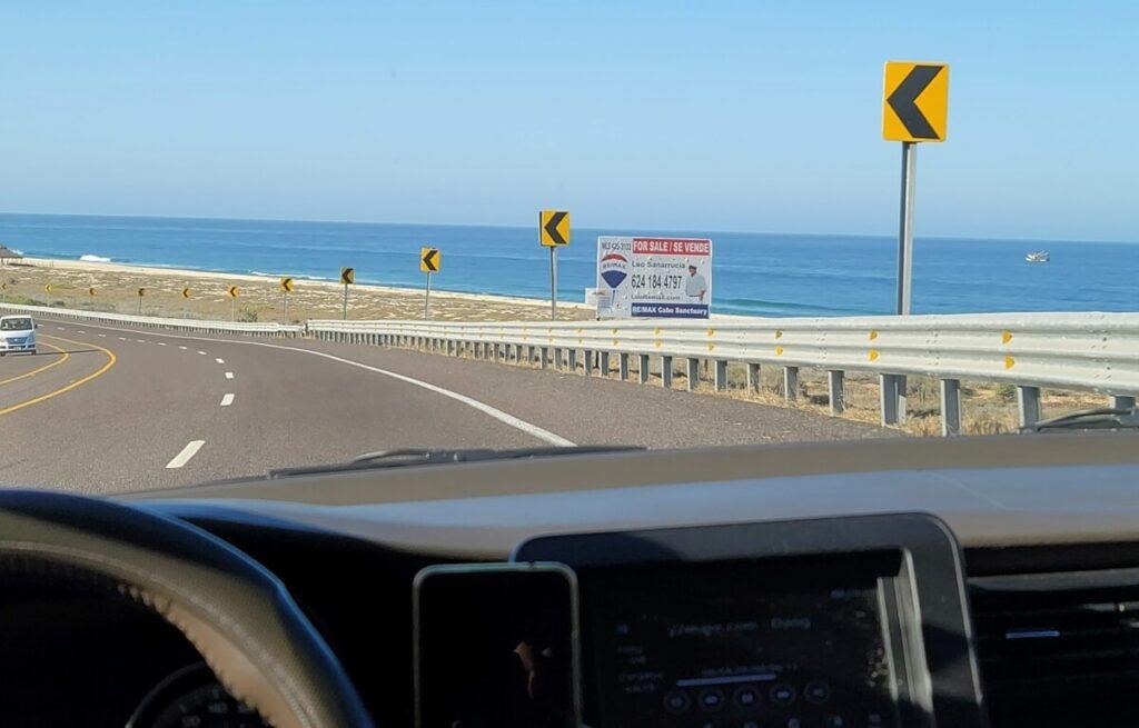 A toll road along the edge of the ocean.