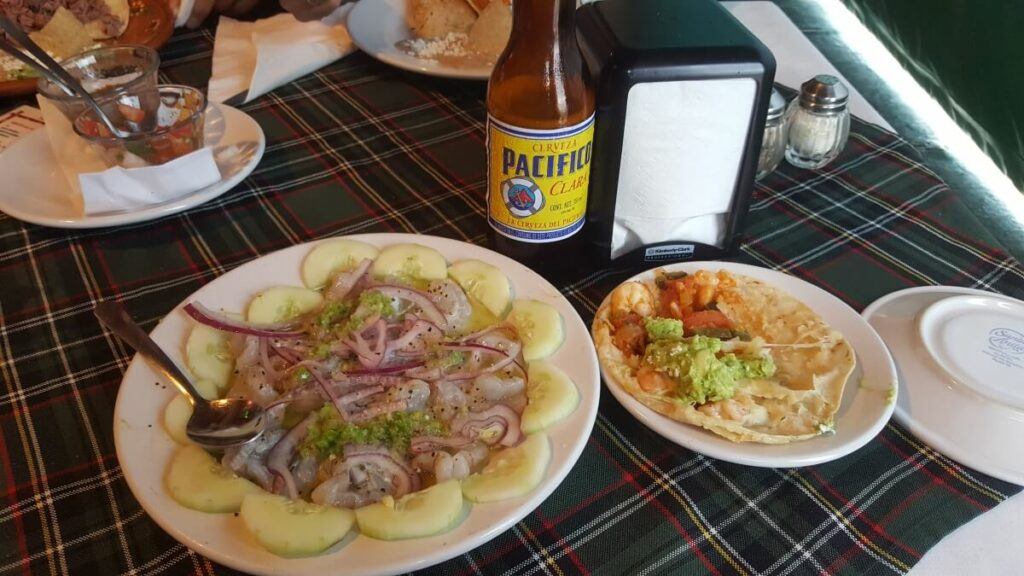 Seafood and beer on a table.