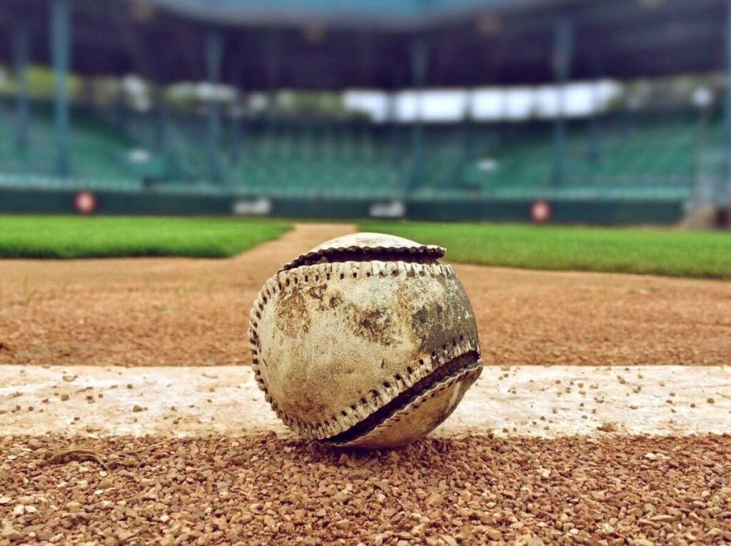A baseball in the middle of a stadium.