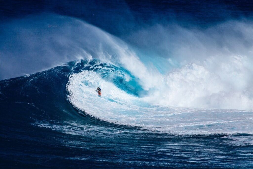 A guy surfing a big wave.