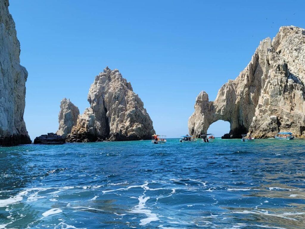 A rock arch in the sea.